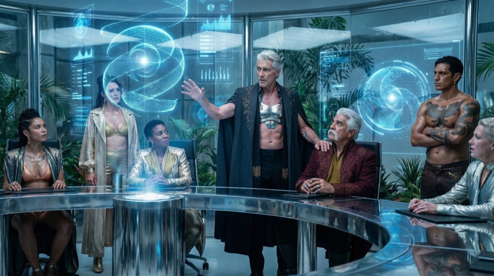 Drakos Methodius domina la pantalla holográfica, QuantumFlow™ espiraleando en nodos luminosos detrás de él mientras los ejecutivos observan hipnotizados.